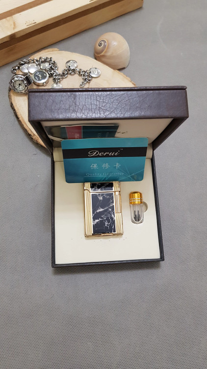 فندک گازی بغل زن مشکی طلایی لاکی دروی لاین 1